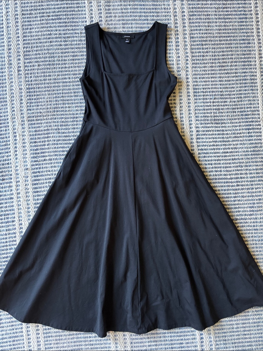 Black dress with full skirt and pockets
